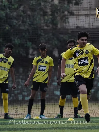A team of players jogs together, showing the unity and shared purpose that I foster in my academy.