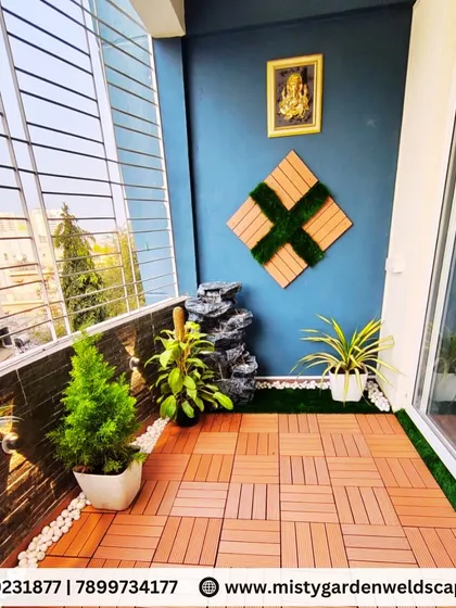 The final look of the balcony transformation, with carefully chosen plants, a calming water feature, and stylish flooring that make the space feel like a true extension of the home.