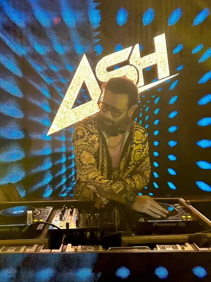 A great shot of me at the console with my logo and dynamic blue visuals lighting up the background. This setup is perfect for making a strong visual impact.