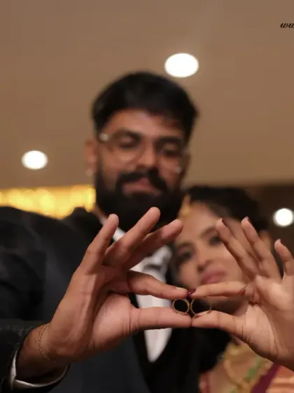 A creative pose showing off the wedding rings. This is a fun way to announce the union and capture a symbolic detail of the day.
