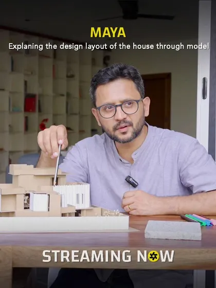 Our process always starts with understanding the space and the story. Here, I'm explaining the design layout for the 'Maya' house using a physical model, which helps us and our clients truly visualize the flow and feel of their future home before we even break ground.