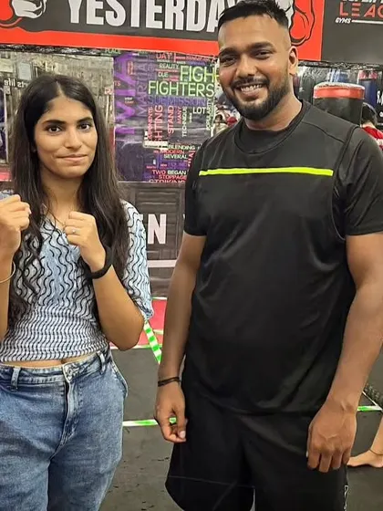 Another shot with a student, showing the friendly and respectful atmosphere of our gym.