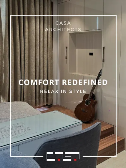 This image highlights a clever space-saving solution in a bedroom, with a raised platform for the bed that incorporates a desk and storage, perfect for a compact room.