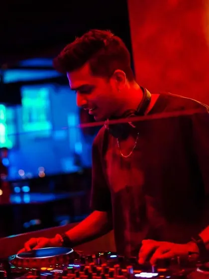 Home is behind the console. A close-up shot under the red and blue lights at Toca, where I feel most comfortable and creative.