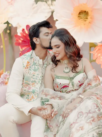 An intimate and happy moment. This close-up shows her glowing skin and the soft, romantic makeup tones.