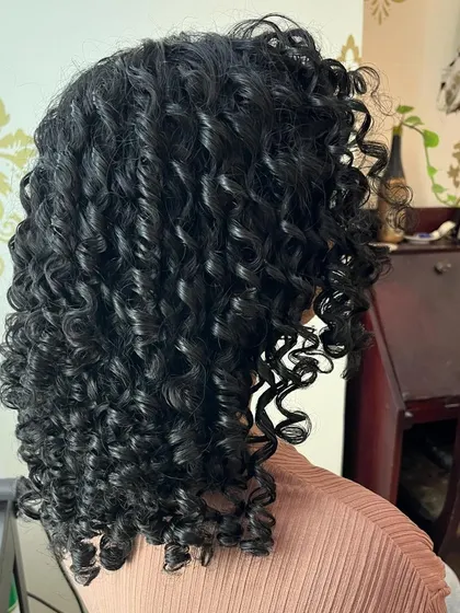 A side view showing the beautiful shape and definition of her new curly style.