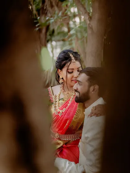 Using the natural environment to frame the couple. Peeking through the trees adds a sense of intimacy and privacy to this beautiful, candid moment.
