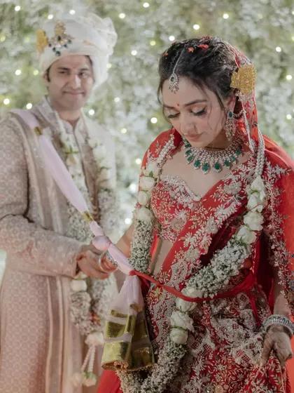 Anaaya and Nikunj during their pheras. This moment captures the solemnity and beauty of the Hindu wedding ritual, as they take their seven steps and vows together.