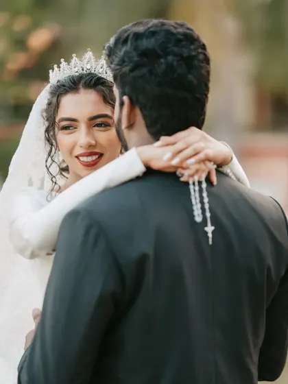 The way she looks at him. This over-the-shoulder shot captures an intimate moment, highlighting her beautiful smile and curly hair.