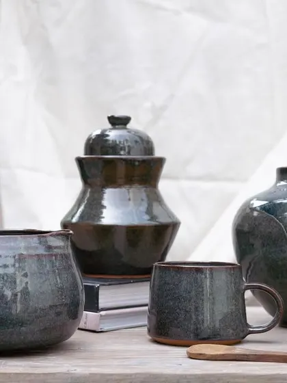 This collection showcases the depth and character of our Pirate Black glaze. It's a stunning glossy black that breaks into subtle hues of purple, blue, and brown, adding complexity and elegance to any piece.