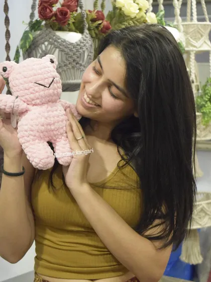 Sharing a smile with our pink crochet frog. We love creating animals in fun, unexpected colors. This plushie is made with soft chunky yarn, making it a great sensory toy.