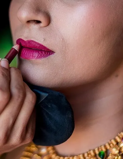 A close-up shot of the bride's makeup being applied. We love capturing these detailed, behind-the-scenes moments of the bridal preparation.