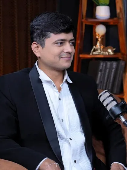 A professional portrait taken during a podcast recording. I use modern platforms to share timeless wisdom.