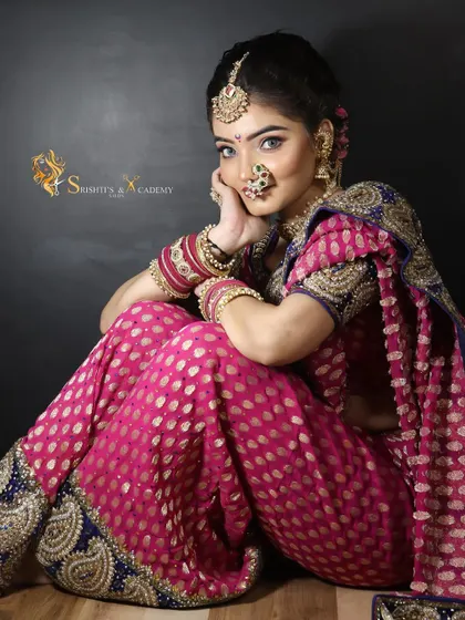 A full portrait of our Maharashtrian bride. The combination of the pink and blue Paithani saree with the bold makeup creates a truly memorable look.