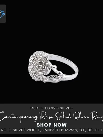 A single rose ring, delicately carved from solid silver with leaf details on the band. A simple, elegant, and romantic design.