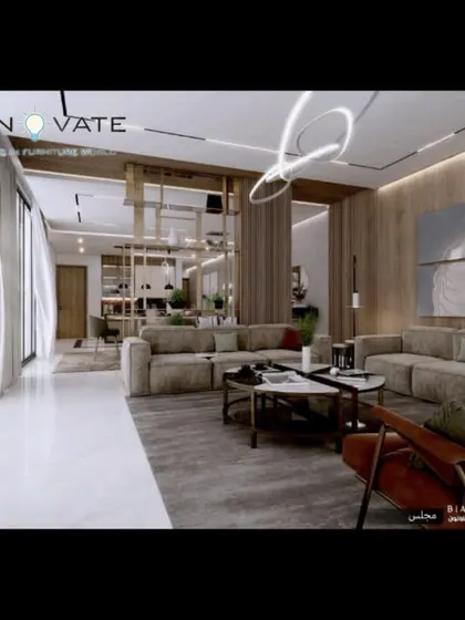 A spacious living room designed with natural wood tones and neutral fabrics. The open layout connects to other areas of the home, creating a seamless flow perfect for modern lifestyles.