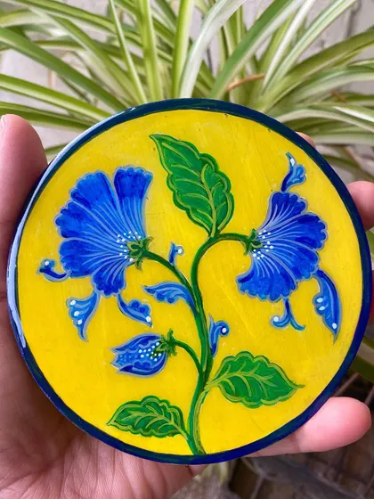 Another shot of the resin-coated floral plate, capturing the vibrancy and depth the resin layer adds to the artwork.