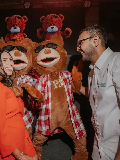The happy couple posing with Mr. Teddy. These playful moments and unique photo-ops are what make my themed parties so special.
