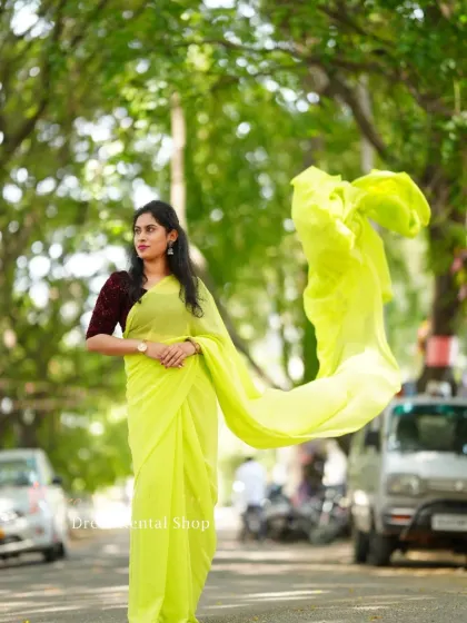 The yellow trail saree's pallu is caught in the wind, showing how it can be used to create artistic, flowing shapes in your photos.