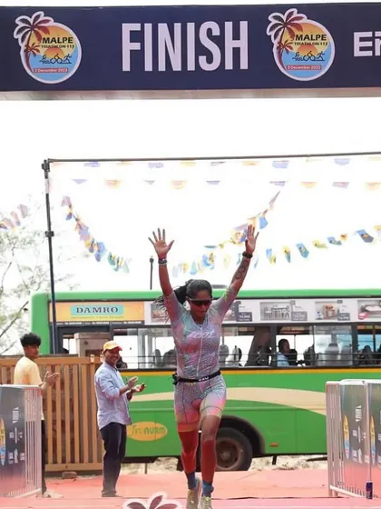 The finish line of the Malpe 113 triathlon. The joy of completing a half-Ironman distance event is immense. I guide athletes through the entire process, from the first day of training to this triumphant moment.