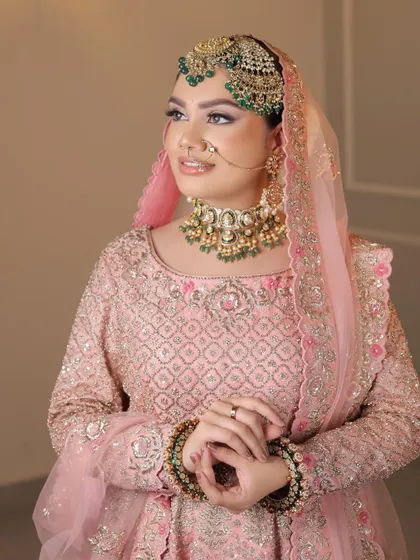 Another portrait of the beautiful Anand Karaj bride, showcasing her soft makeup and elegant, clean hairstyle.