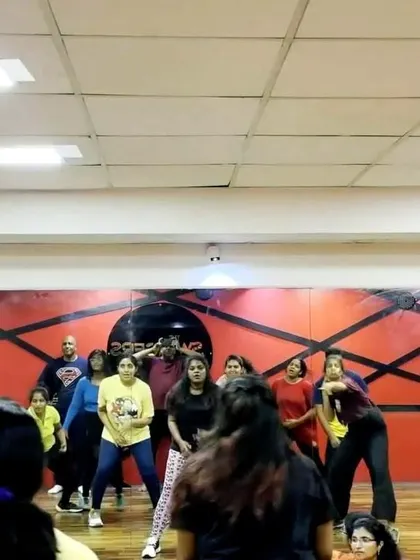 A group of students learning choreography in front of the studio mirror. Rehearsals are intense but always filled with positive energy.