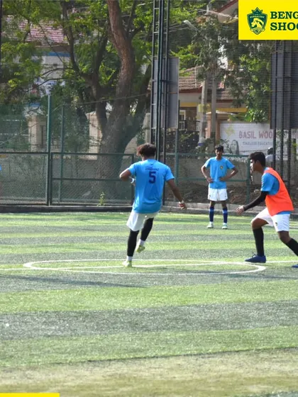 Players engage in a midfield battle for possession. Our training emphasizes the importance of controlling the center of the pitch to dictate the flow of the game.
