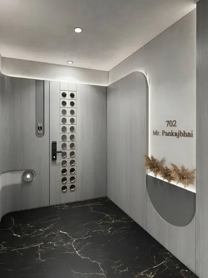 This ultra-modern entryway has a futuristic feel with its curved walls, integrated lighting, and unique circular peepholes on the door. The black marble floor adds a touch of drama.