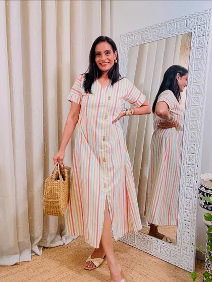 A simple and chic striped A-line dress. The vertical stripes are flattering and the pockets add a practical touch.