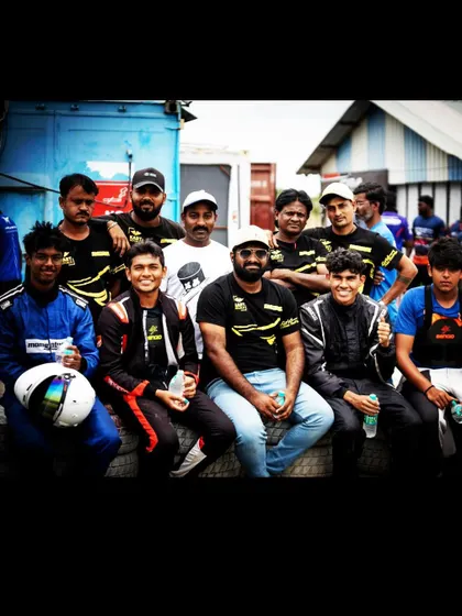 The team relaxing together in the pit garage. These moments of camaraderie are essential for building a strong, cohesive unit that can handle the pressures of a race weekend.