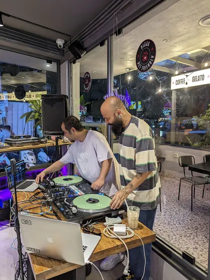 Another shot from the Pijja event, showing the full workstation with laptops and turntables.