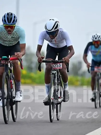 A breakaway of three riders works hard to maintain their gap from the main field.