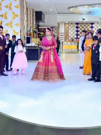 The bride's solo entrance at the reception, walking on a cloud of low-lying fog as guests look on.