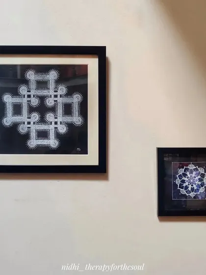 A pair of my black and white mandala artworks hanging on a wall. The contrast is striking, and they bring a sense of detailed geometry to the space.
