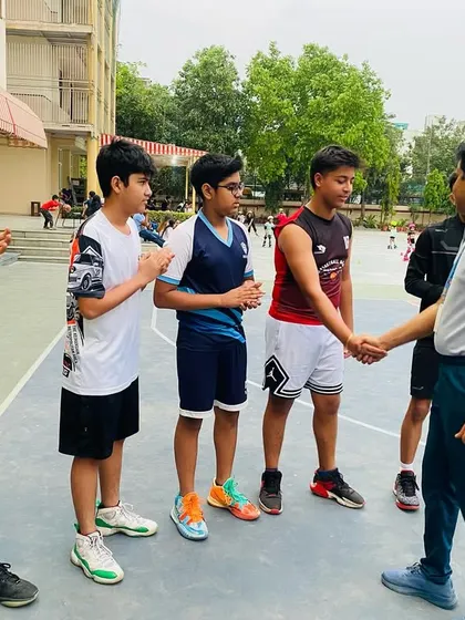 Shaking hands with each player to acknowledge their hard work and dedication.