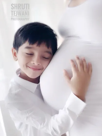 A big brother's love. Including siblings in maternity shoots creates incredibly heartwarming moments like this one. It’s a beautiful way to capture the growing family bond.