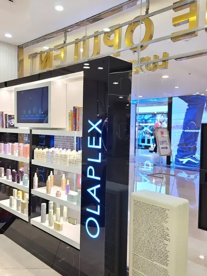 Luxury redefined. The salon's exterior showcases the premium brands I trust, like Olaplex and Kevin Murphy, right from the moment you approach.
