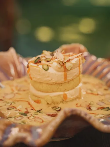 A tighter, close-up shot of the layered dessert, focusing on the creamy texture and caramel drizzle. This perspective is all about making the viewer crave a bite.