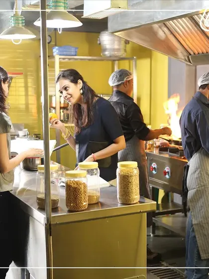 Here I am in the kitchen with my team, tasting and ensuring everything is perfect. I love being hands-on and working alongside the people who make 6meal possible. The energy and dedication here are incredible.