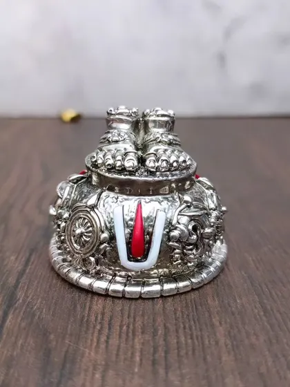 A German silver version of the Lord Venkateshwara Swamy Padam, beautifully detailed with red and white enamel for the Naamam.