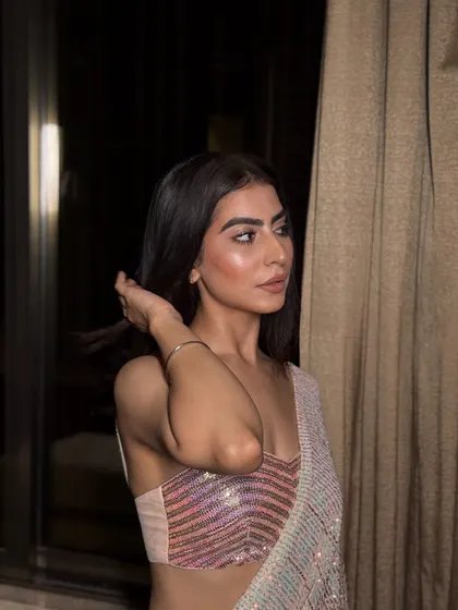 My 'desi girl' Twinkle, looking stunning in a sequin saree. The makeup was kept soft and glowy to let the outfit shine, with a focus on luminous skin and a simple nude lip.