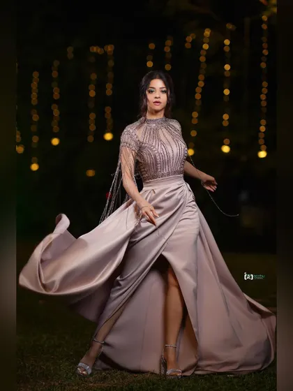 A full-length shot showcasing a magnificent flowing gown. We used a fan to create movement, turning the dress into a piece of art. This is a perfect example of a dynamic, high-fashion portrait.