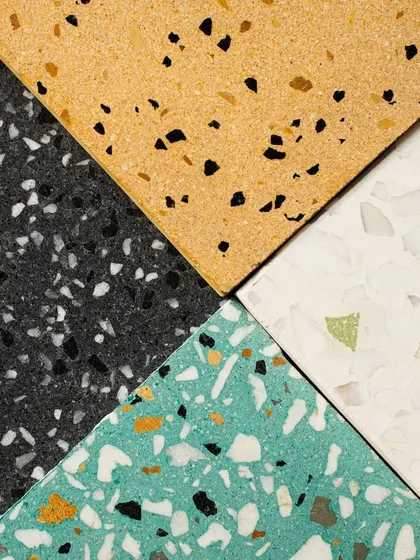A four-quadrant composition of different terrazzo styles, from dark and moody to bright and colorful.