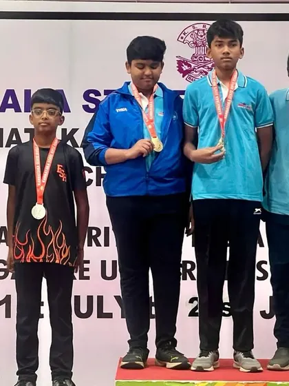 Our youth men's team proudly displays their silver medals for the 10m Air Rifle ISSF event at the Karnataka State Shooting Championship. Team events build camaraderie and competitive spirit.