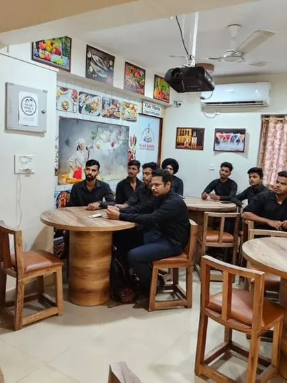 An instructor conducting an interview skills workshop, using a whiteboard to explain key concepts to students in Pune.