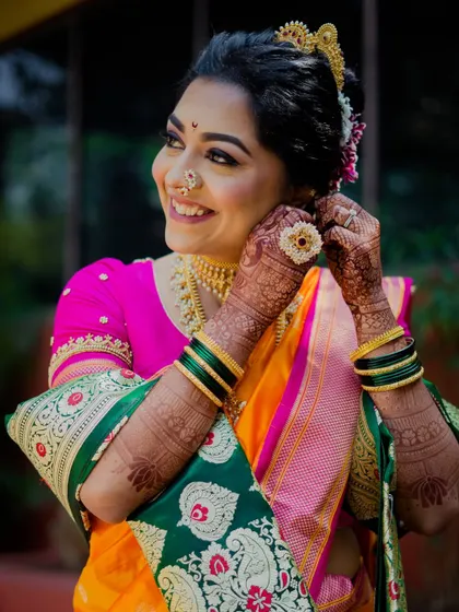Draped in a traditional nauvari saree, Sneha embraced her roots gracefully. This look was for an international wedding, blending cultures with a classic Maharashtrian aesthetic.