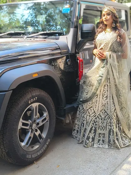 Posing with a Thar in our beautiful green and silver lehenga. Our outfits are perfect for creating those cool, edgy photoshoots.