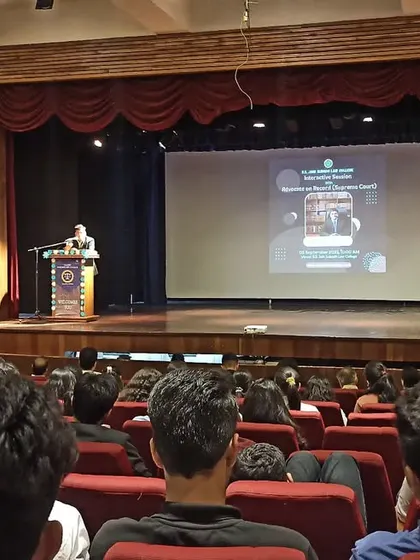 A view from the audience as I speak on stage at the S.S. Jain Subodh Law College auditorium.