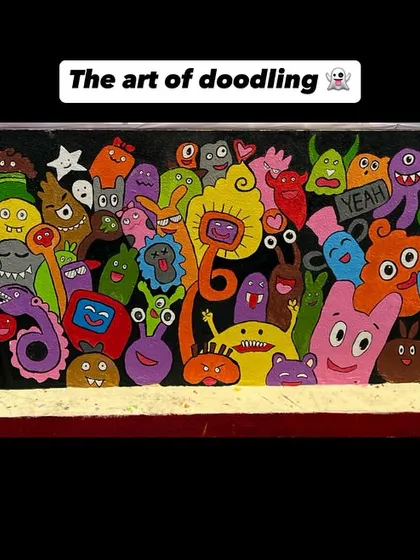 This wall is covered in a crowd of colourful and quirky doodle monsters, each with its own personality. It’s a fun, abstract design that sparks imagination.