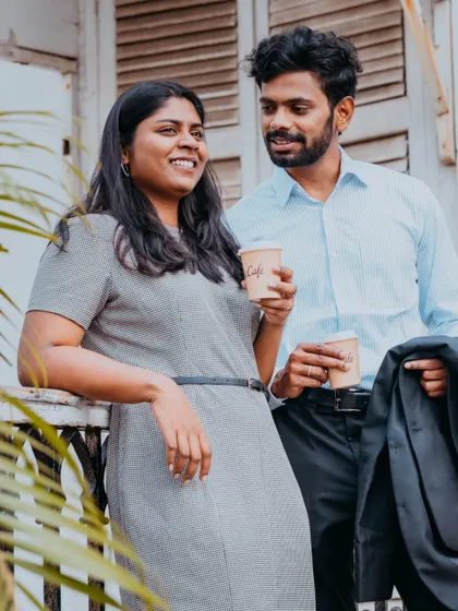 A lifestyle shot of a couple enjoying a coffee break together, perfect for a relaxed and modern pre-wedding album.